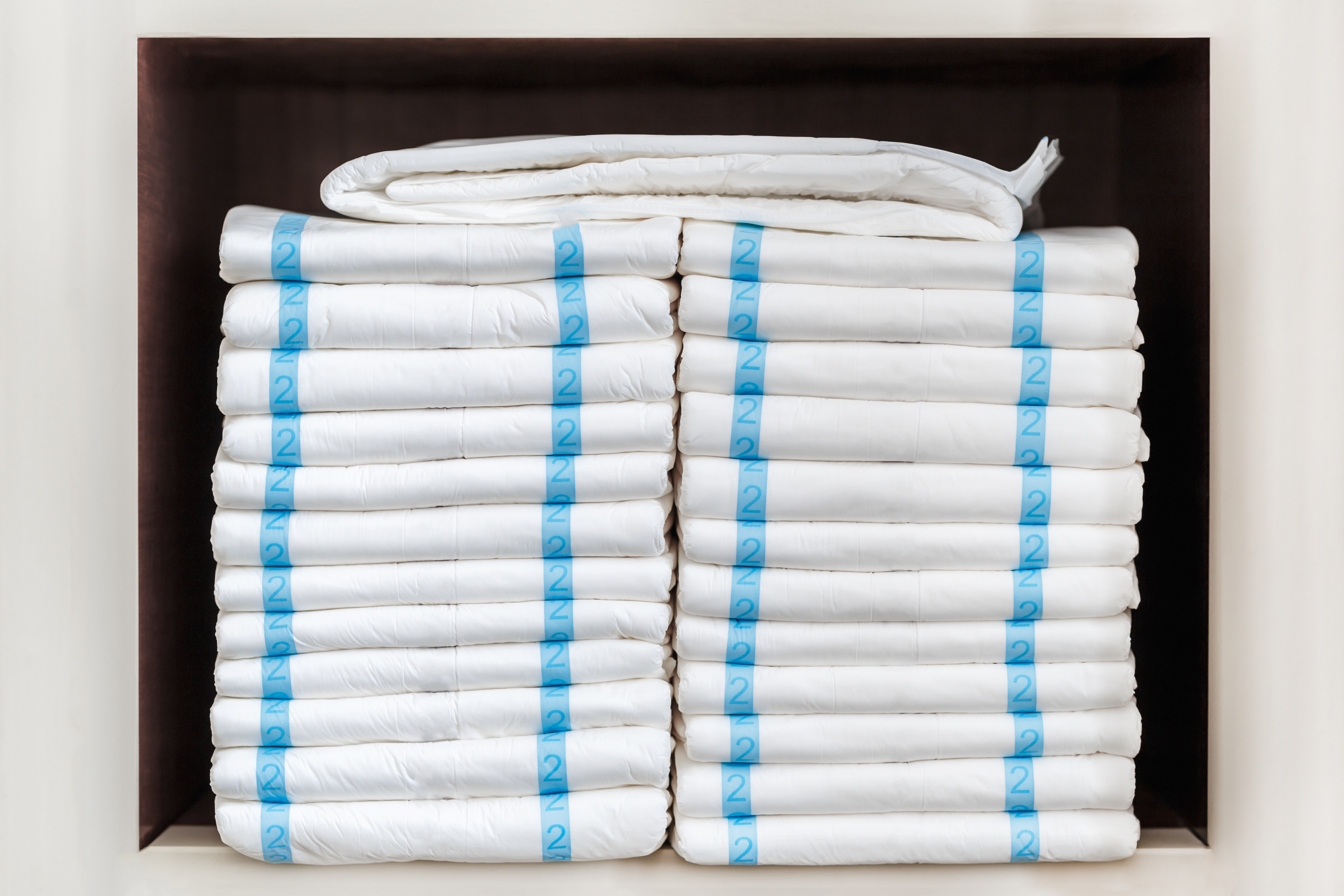 Stack of diapers on two even piles. 